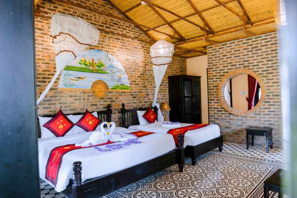 chambre deluxe triple à Hue Ecolodge